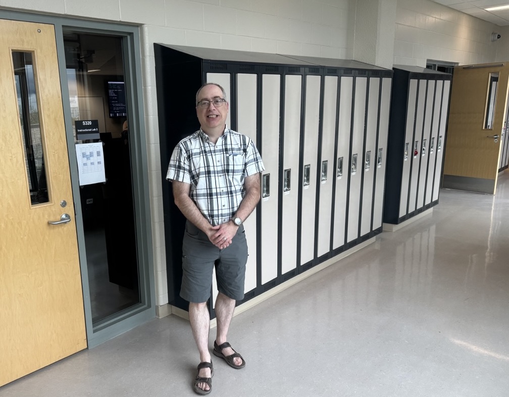 Greg Oster stands in front of an instructional lab